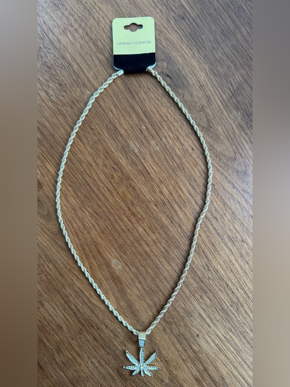 Gold 22 inch Gold Tone Chain with Cubic Zirconia Pot Leaf 420